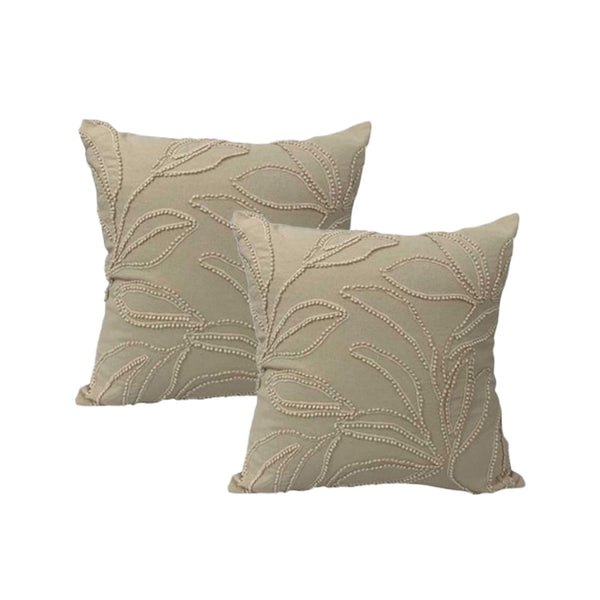 Elegant natural feather-filled cushions featuring delicate leaf embroidery on soft cotton canvas add a touch of luxury to any space.