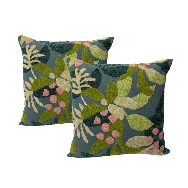 alt="Luxurious cushion adorned with exquisite green and pink embroidered flowers. Plush, feather-filled for a soft, opulent touch."