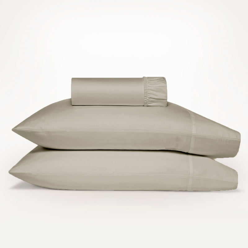Luxurious Ddecor Home 1500 Thread Count Sand Fitted Sheet and Pillowcase Set, combining cotton and polyester for comfort and easy care.