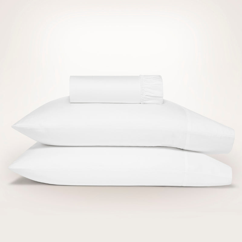 Luxurious Ddecor Home 1500 Thread Count Snow Fitted Sheet and Pillowcase Set, combining cotton and polyester for comfort and easy care.