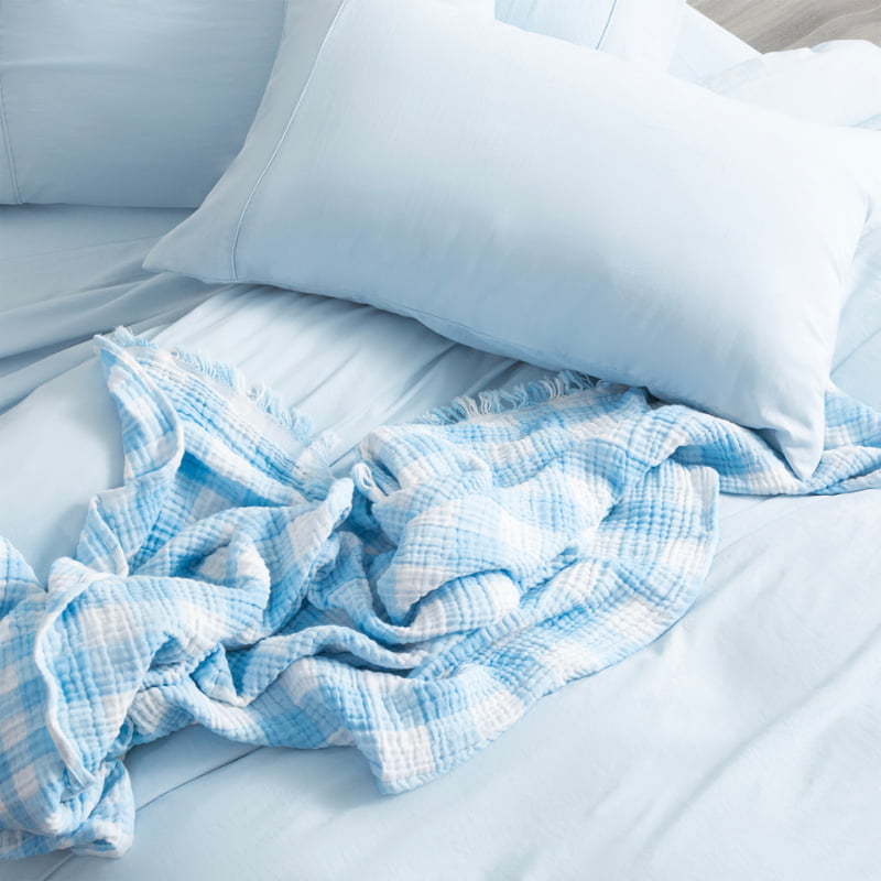 Elegant bed featuring blue colour microfibre quilt cover set, creating a seamless look for your bedding.