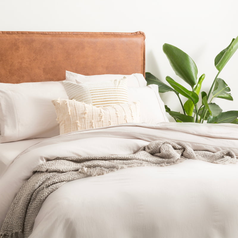Elegant bed featuring sand colour microfibre quilt cover set, creating a seamless look for your bedding.