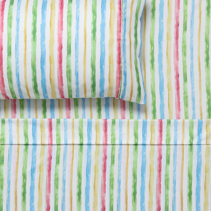 alt="Close up look of a child's bed with Happy Kids' vibrant microfibre sheet set."