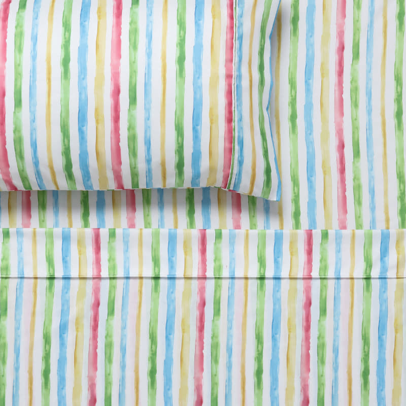 alt="Close up look of a child's bed with Happy Kids' vibrant microfibre sheet set."