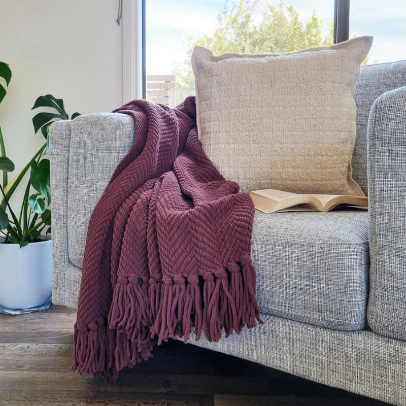 A stunning throw with chevron weave, knotted fringe on each side, trendy winter colours for on-point styling to your bedroom