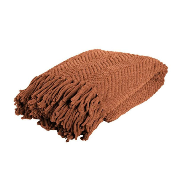 A brown blanket with fringes on each side featuring a chevron weave and trendy winter colours.