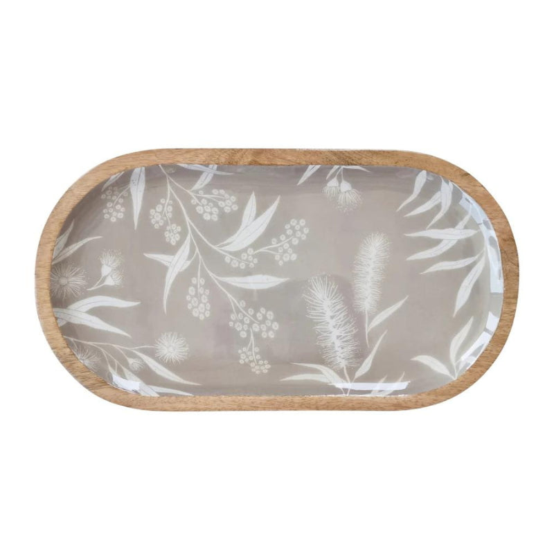 alt="Front details of a grey oval serving tray featuring a natural native flora"