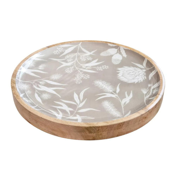 alt="Side details of a grey round serving tray featuring a natural native flora"