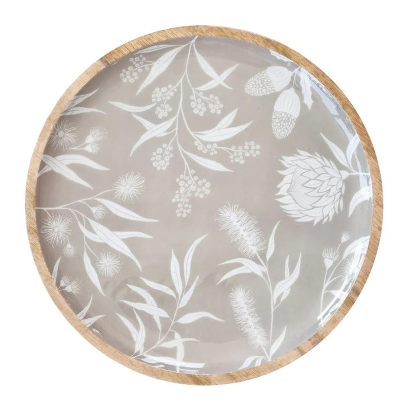 alt="Front details of a grey round serving trays featuring a natural native flora"
