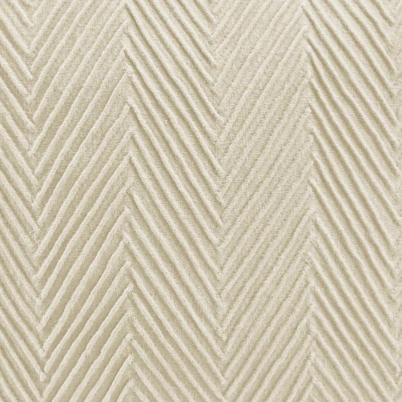alt="Close up details of a stunning cream cushion with an embossed chevron design on high-quality cotton fabric"
