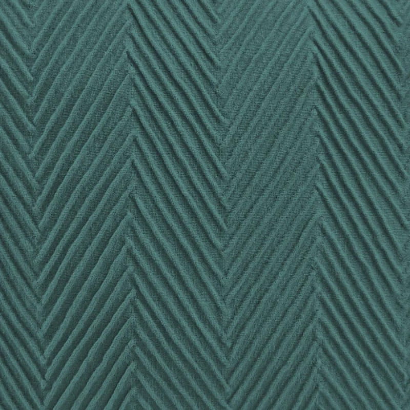 alt="Close up details of a stunning green cushion with an embossed chevron design on high-quality cotton fabric"