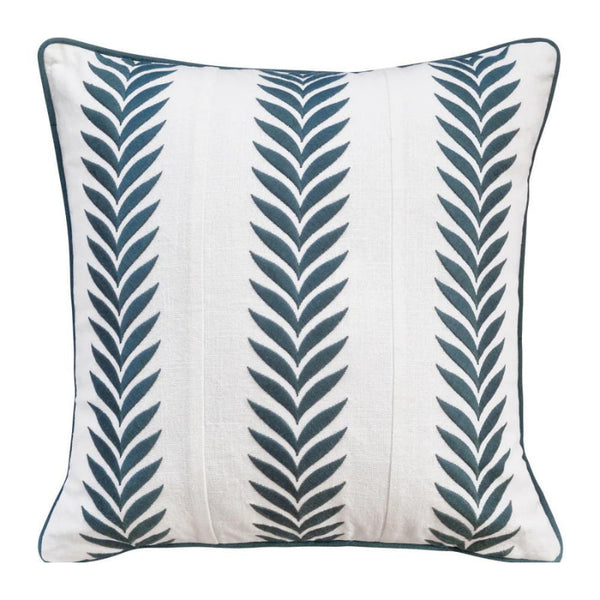 alt="Front details of a coastal inspired green and ivory cushion featuring an embroidered geometric leaf design with piped edging"