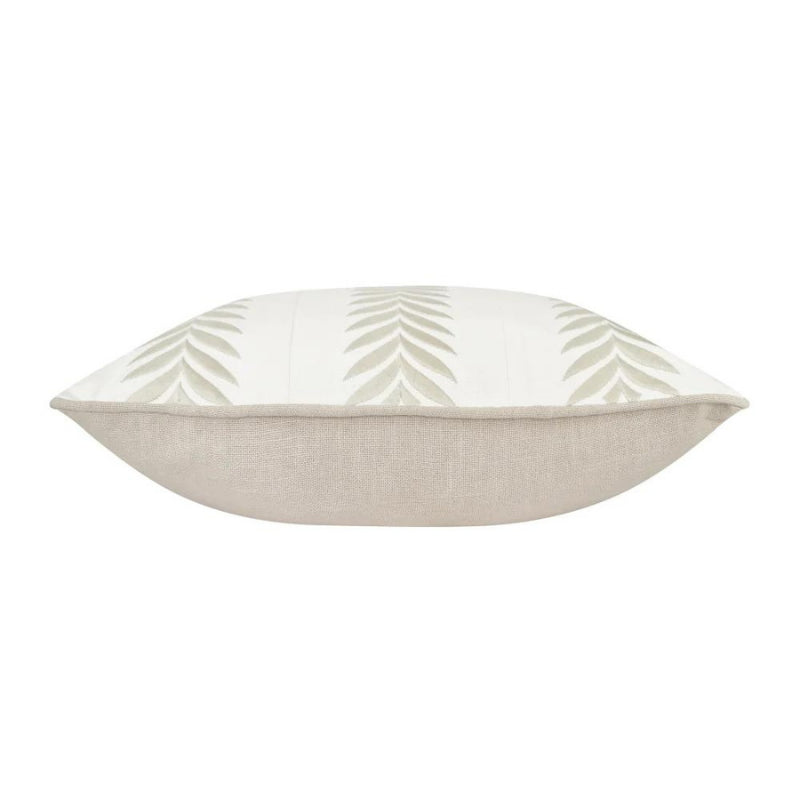 alt="Side details of a coastal inspired grey and ivory cushion featuring an embroidered geometric leaf design with piped edging"