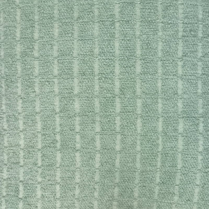 alt="Zoom in details of a stunning mint cushion featuring a soft, durable boucle fabric"