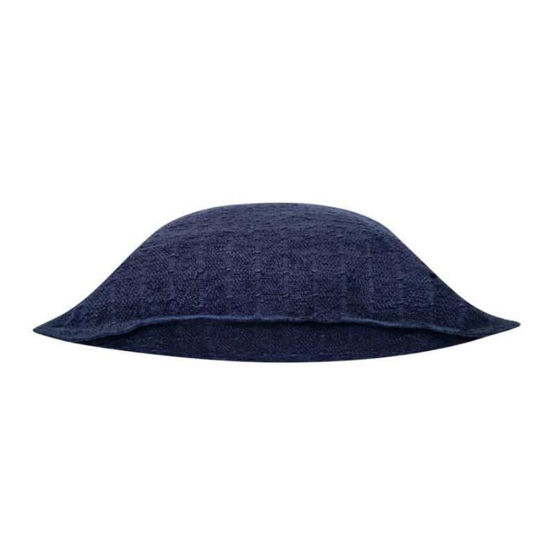 alt="Side details of a navy cushion featuring a soft, durable boucle fabric"