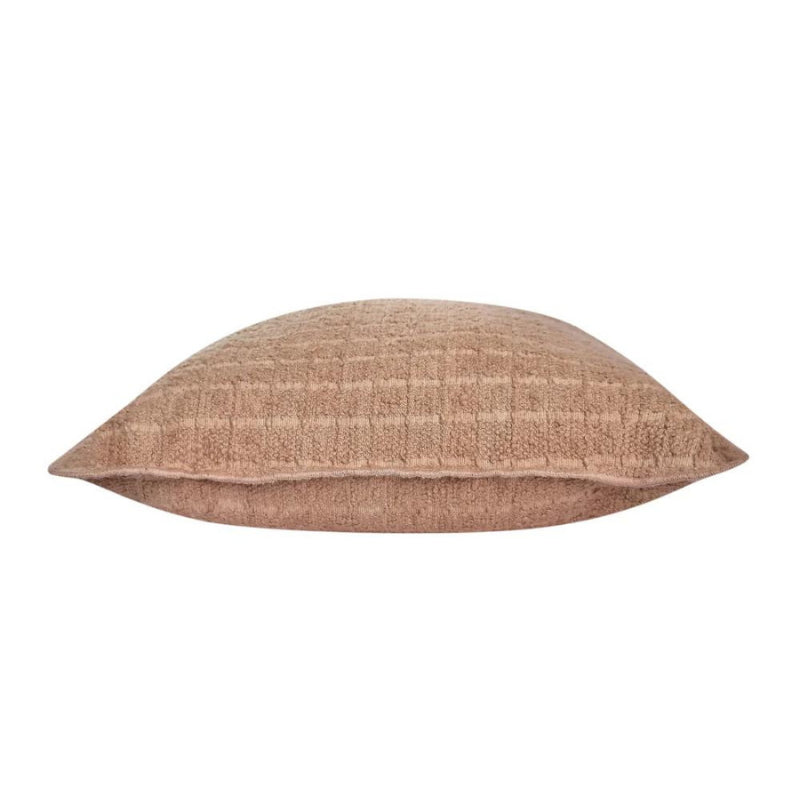 alt="Side details of a brown cushion featuring a soft, durable boucle fabric"