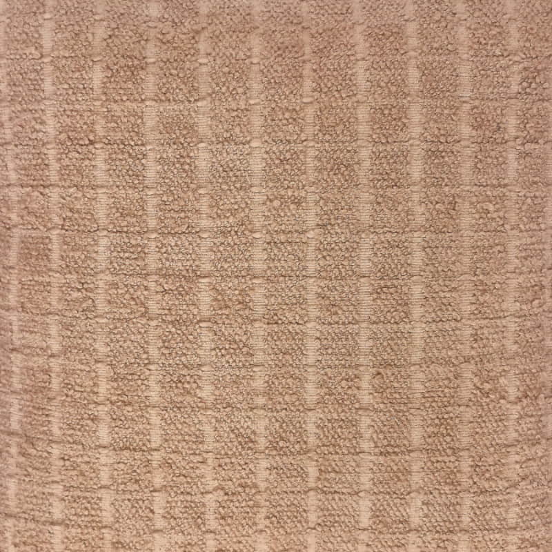 alt="Close up details of a brown cushion featuring a soft, durable boucle fabric"
