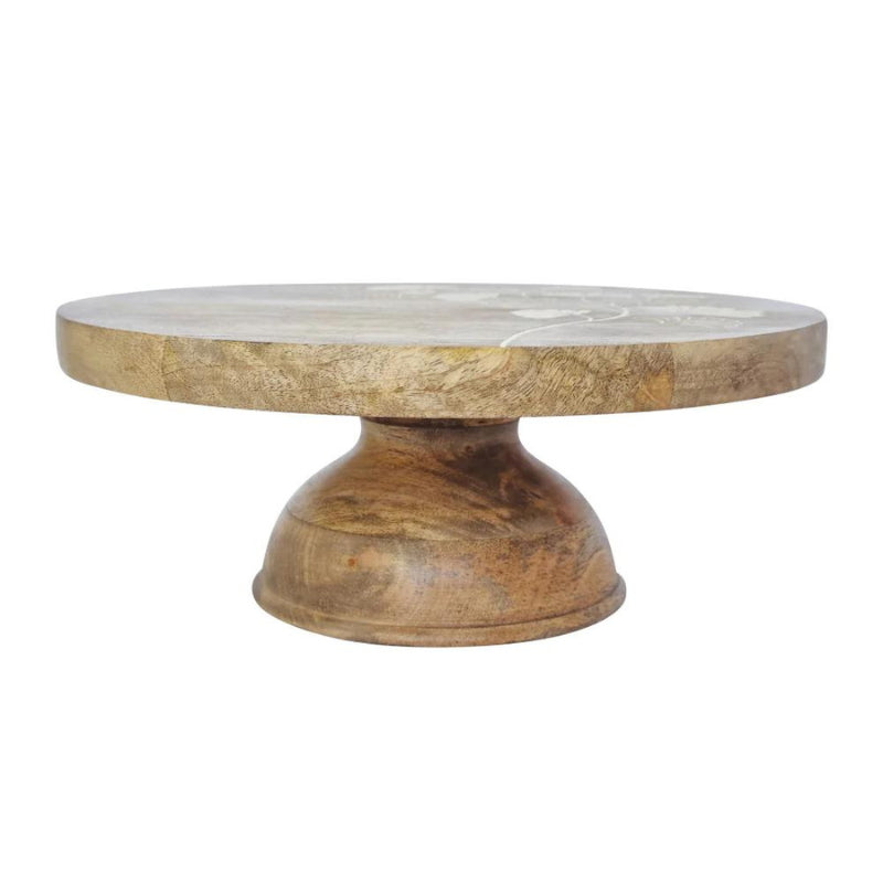 alt="Side details of a natural cake stand featuring hand-carved with a delicate ginkgo leaf design"