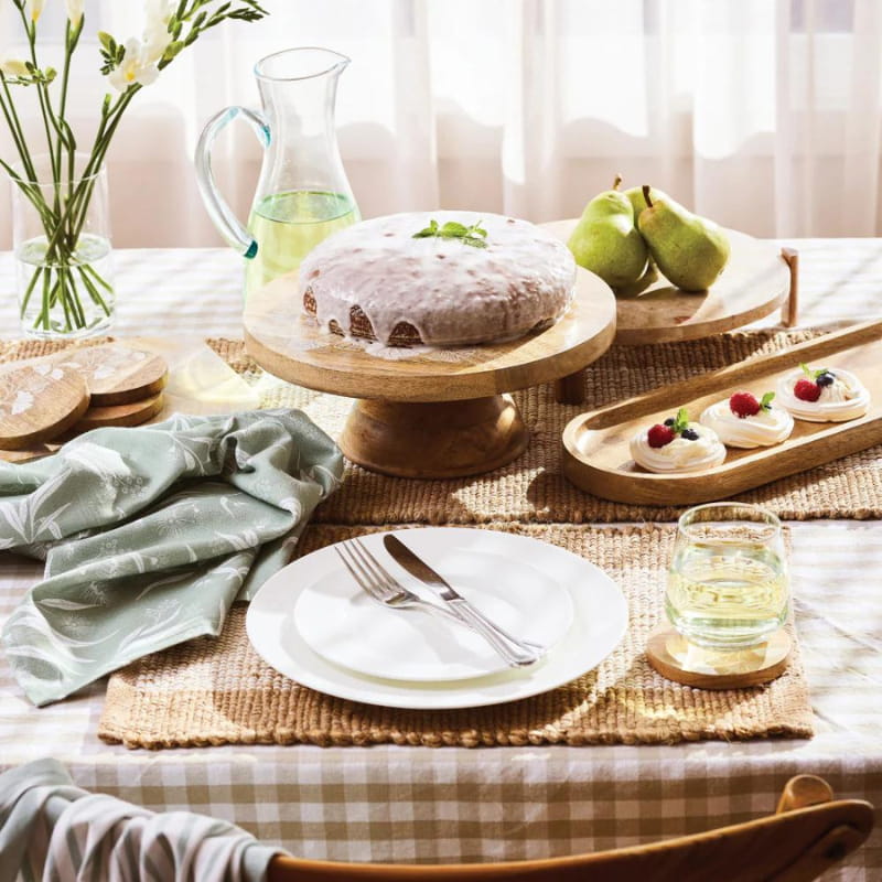 alt="A natural cake stand featuring cohesive and exotic dining setting"
