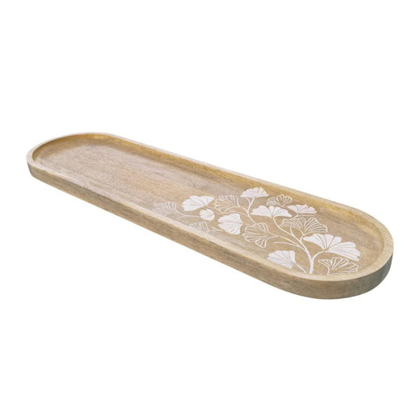 alt="Side details of a natural long serving tray featuring hand-carved ginkgo leaf design"