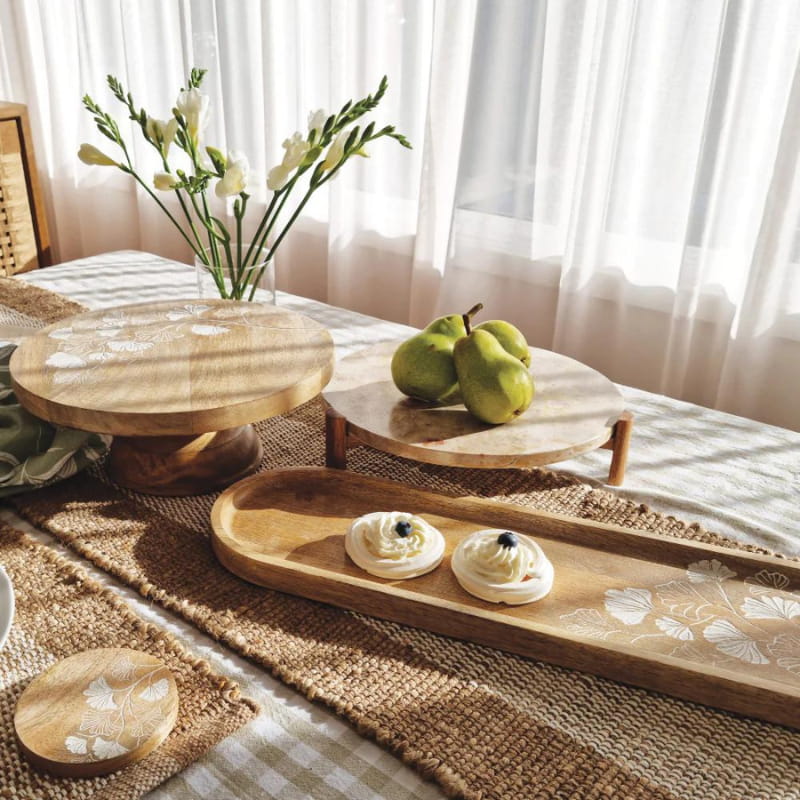 alt="Natural long serving tray featuring a hand-carved ginkgo leaf in a stunning table setup"