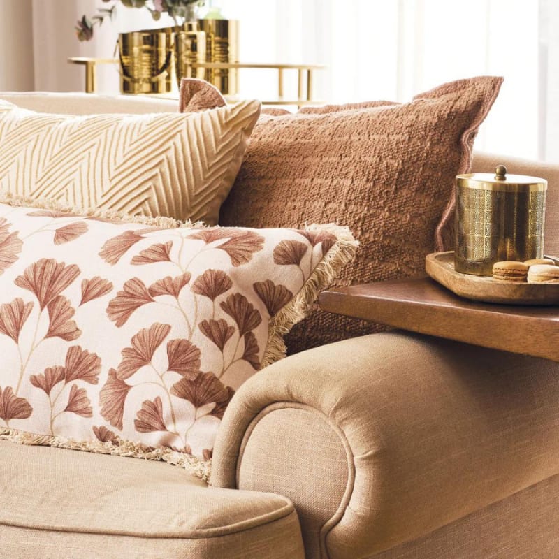 alt="Versatile home accessory: Ginkgo print cushion for a touch of elegance."