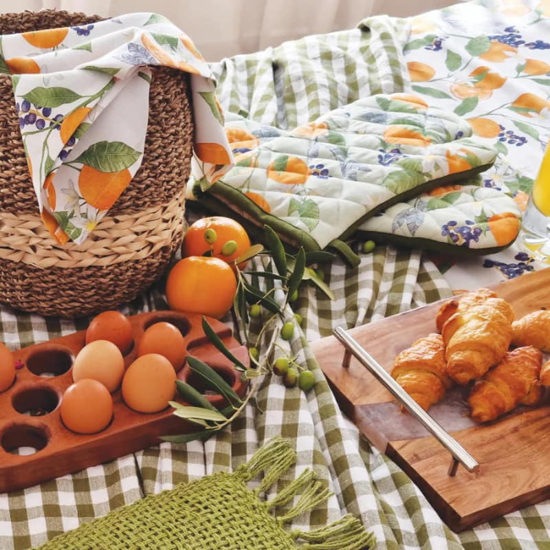alt="a fresh table arrangement with mittens, eggs and croissants"