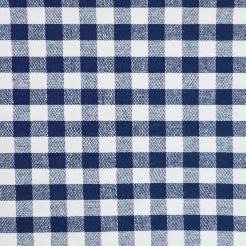 alt="a close-up details of a navy and white patterned gingham fabric" 