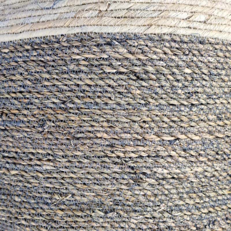 alt="Zoom in details of basket featuring its natural beauty and durability of seagrass."