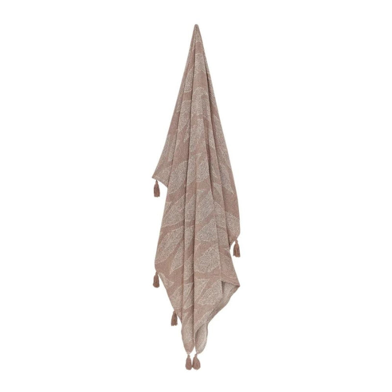 alt="A hanging brown throw featuring a leaf design pattern"