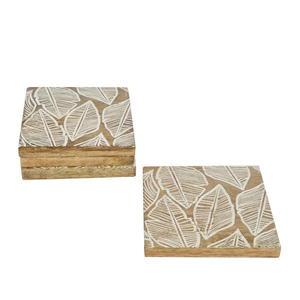 alt="A natural coaster set of 4 featuring feauturing a handcrafted delicate leaf design from high-quality mango wood"