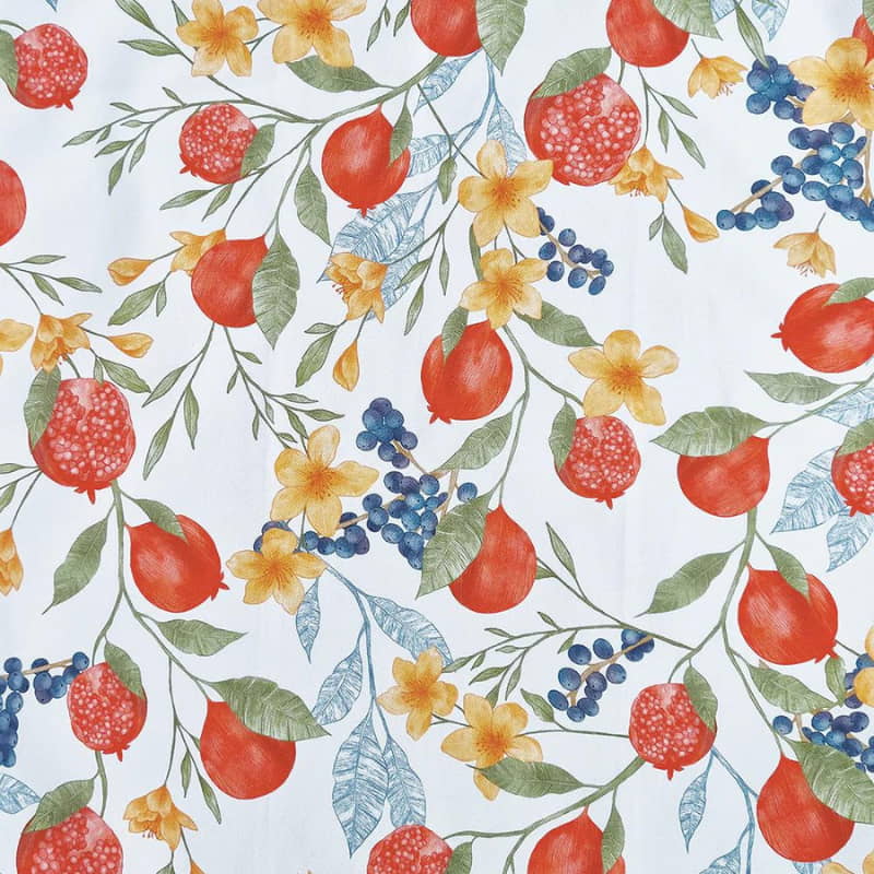 alt="Close-up details of a white multi tea towel featuring a pomegranate design"
