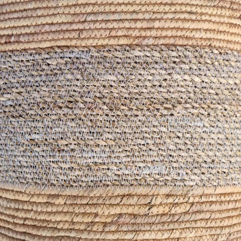 alt="Zoom in details of a basket featuring its natural beauty and durability of seagrass."