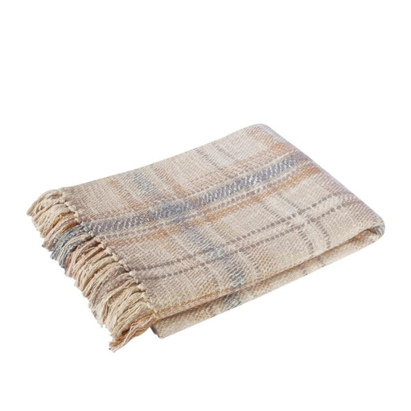 alt="A grey multicoloured throw features a playful check pattern weaved from different coloured string, with tassels on each side"