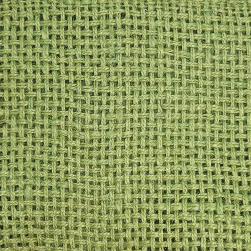 alt="Close-up look of a unique eco-friendly jute green runner with playful fringe."