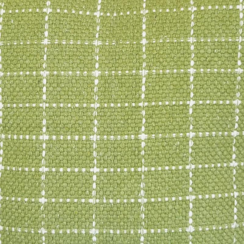 alt="Close-up details of a green cushion featuring a cream check pattern"