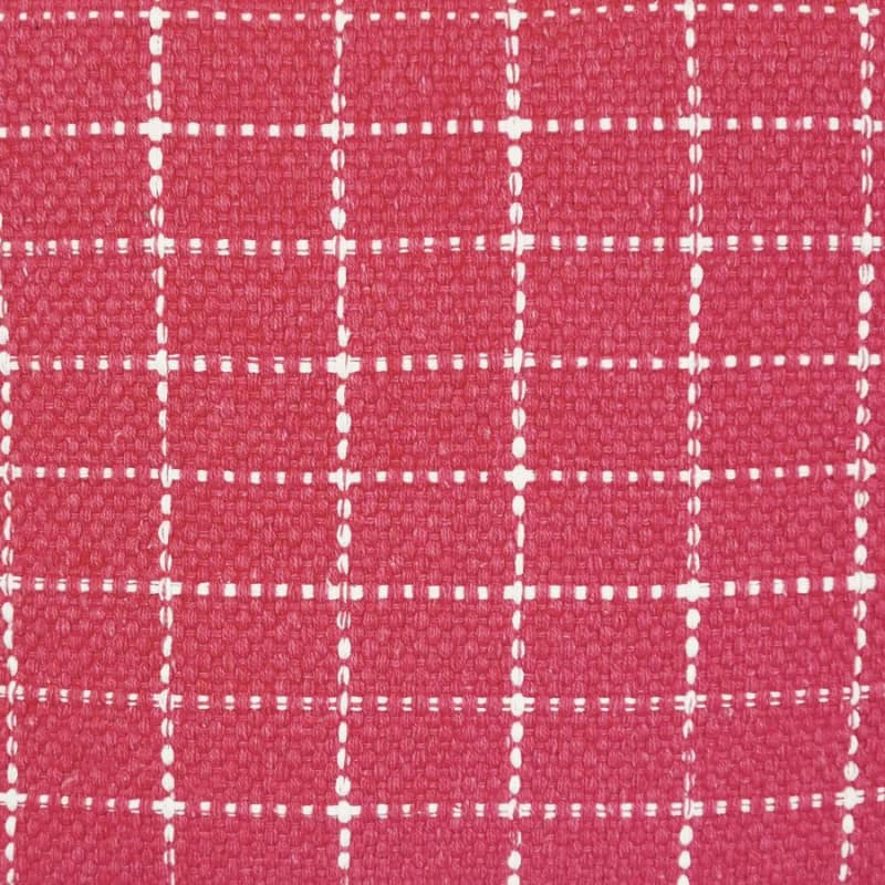 alt="Close-up details of a red cushion featuring a cream check pattern"