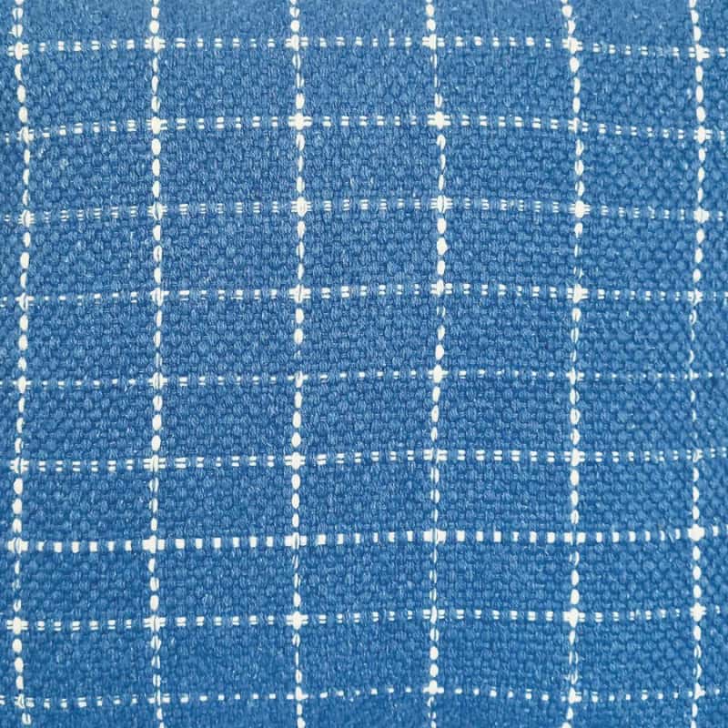 alt="Close-up details of a blue cushion featuring a cream check pattern"