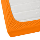 A luxurious mattress with orange fitted sheet, offering comfort and elegance for a restful night's sleep.