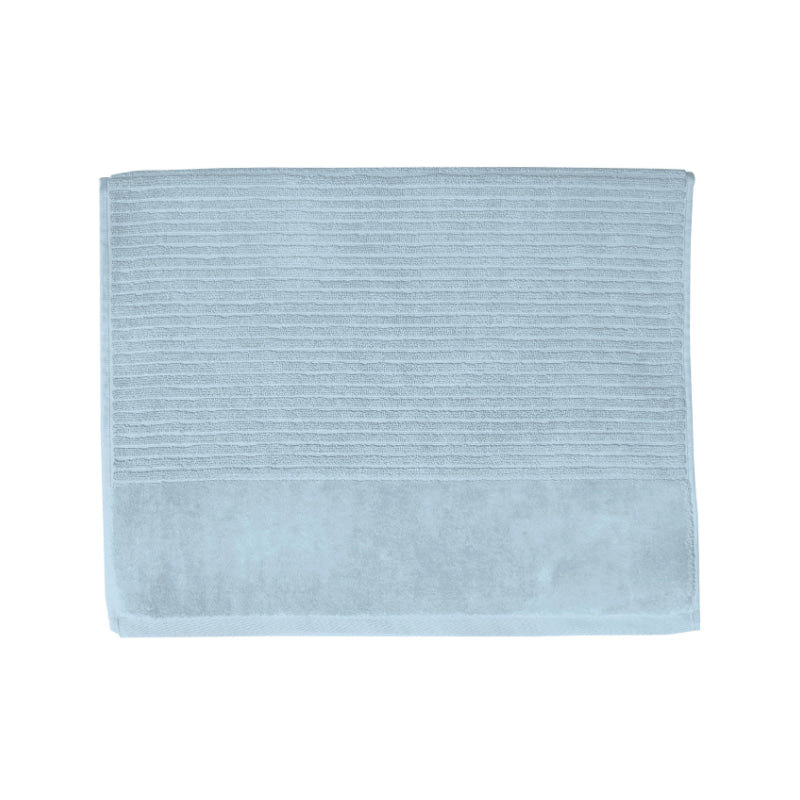 A baby blue bath mat on a white background, highlighting its luxurious feel and vibrant hue, perfect for enhancing bathroom decor.