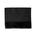 A black bath mat on a white background, highlighting its luxurious feel and vibrant hue, perfect for enhancing bathroom decor.