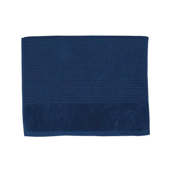 A navy bath mat on a white background, highlighting its luxurious feel and vibrant hue, perfect for enhancing bathroom decor.