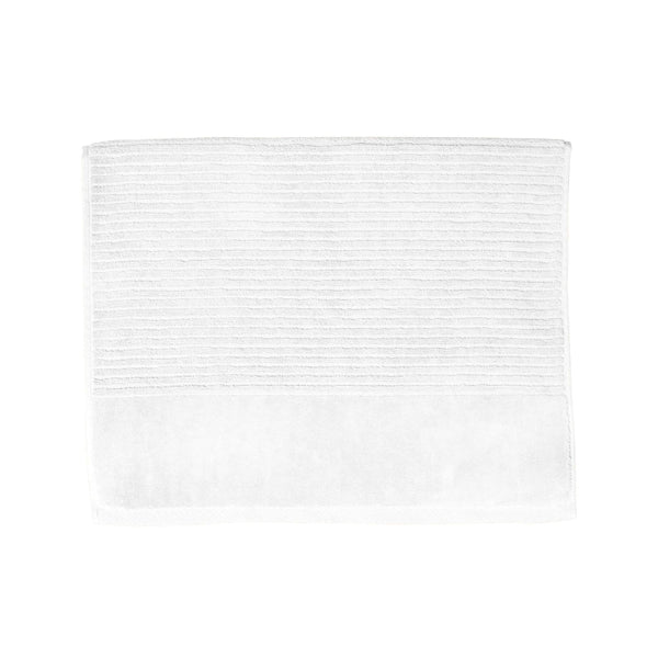 A snow white bath mat on a white background, highlighting its luxurious feel and vibrant hue, perfect for enhancing bathroom decor.