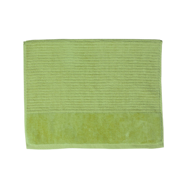 A spearmint green bath mat on a white background, highlighting its luxurious feel and vibrant hue, perfect for enhancing bathroom decor.