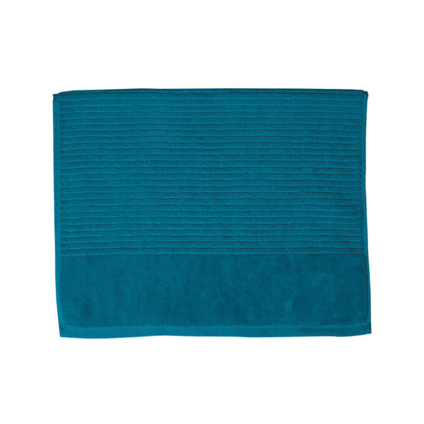 A teal bath mat on a white background, highlighting its luxurious feel and vibrant hue, perfect for enhancing bathroom decor.