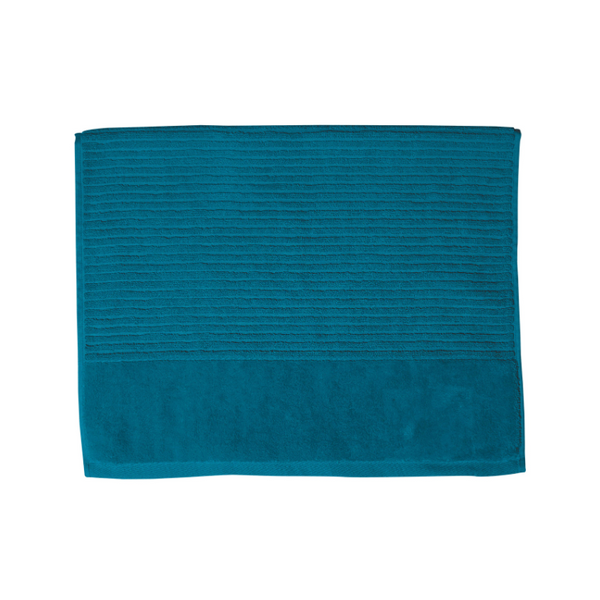 A teal bath mat on a white background, highlighting its luxurious feel and vibrant hue, perfect for enhancing bathroom decor.