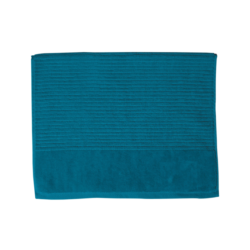 A teal bath mat on a white background, highlighting its luxurious feel and vibrant hue, perfect for enhancing bathroom decor.