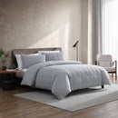 Side view of pillow with stitched box quilting in soft grey jersey fabric