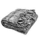 A multicoloured fringed throw, designed for comfort and style, suitable for both outdoor adventures and home relaxation.