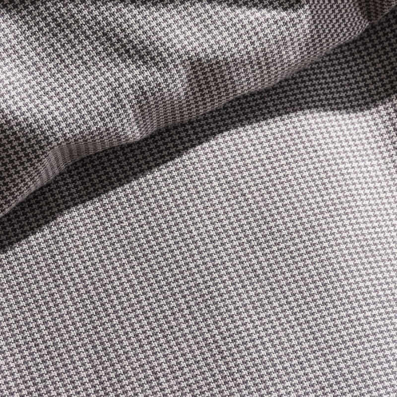 alt="Closer view of the detailed houndstooth check pattern quilt cover set"